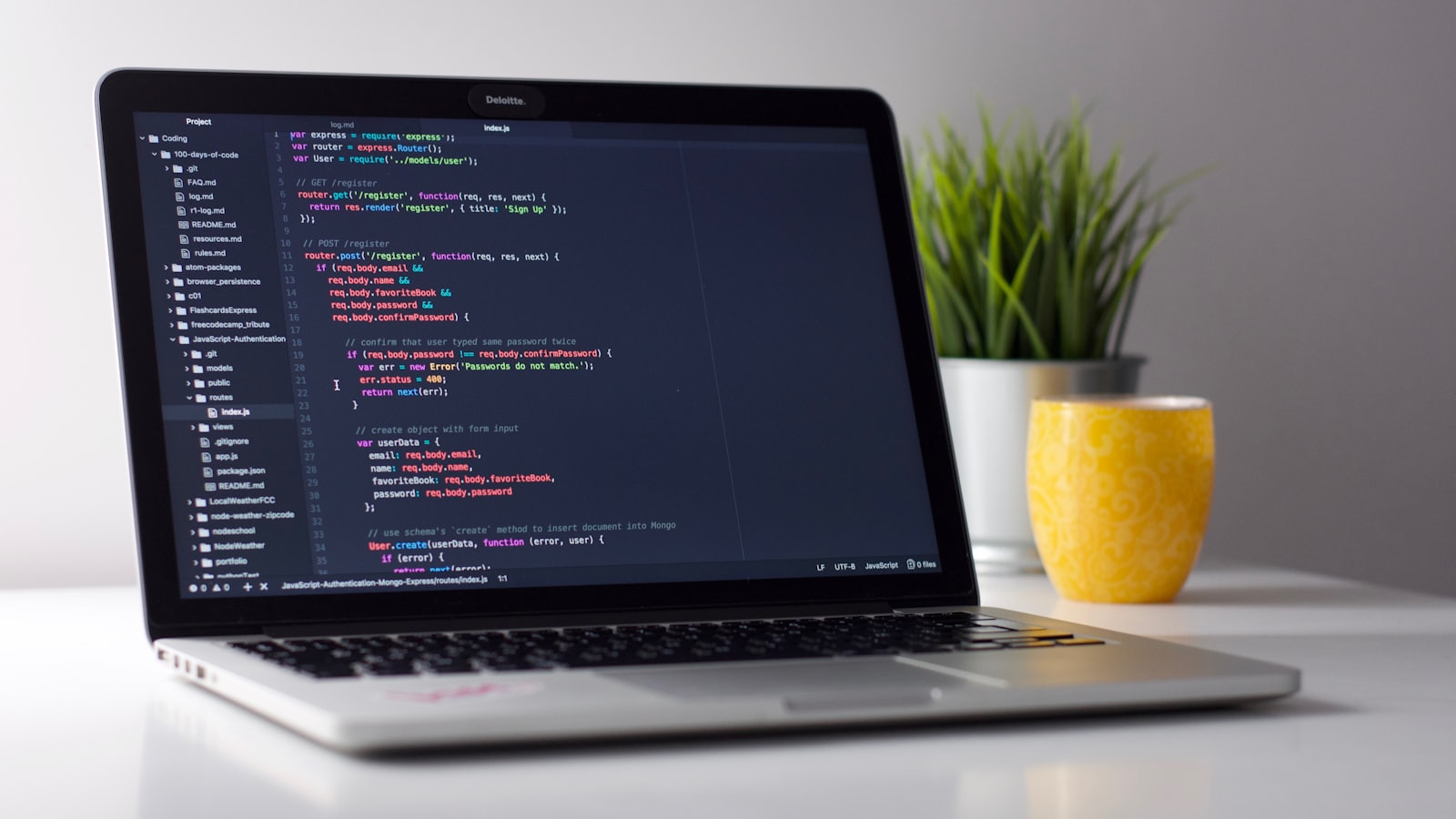A workspace with a laptop and notebook — the kind of setup a small business owner uses to plan and launch online.